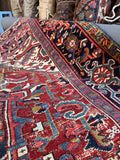 9x12 antique geometric Persian rug, authentic Heriz carpet with large medallion and vibrant natural colors.