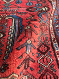 Hand knotted Persian area rug from the 1920s woven with high quality substantial wool pile.