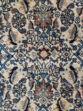 Vegetable dyed Persian area rug close up showing high density weave and rich indigo and rust detailing.