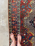 Abrashed blue tones in main border of vintage Bakhtiari rug.