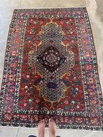 Full view of stylized Persian Bakhtiari rug from the 1920s.