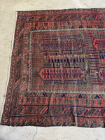 Nomadic pattern with intricate symbolic motifs.