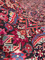 Pink and berry red highlights in Karabagh rug