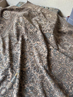 Low pile texture on vintage Persian wool rug.