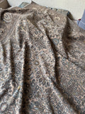 Low pile texture on vintage Persian wool rug.