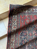Corner view of antique Persian Bibikabad runner showing soulful wear and aged beauty across the field.