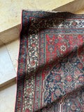 Corner view of antique Persian Bibikabad runner showing soulful wear and aged beauty across the field.