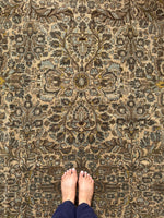 Golden yellow accents in antique Persian wool rug.