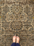 Golden yellow accents in antique Persian wool rug.