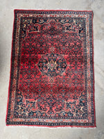 Bidjar rug on floor showing rich color and intricate design.