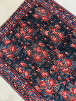 Diagonal view of the vegetable dyed wool in deep reds and blues.