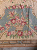 Decorative antique Aubusson textile with intricate flatwoven craftsmanship and romantic floral movement.