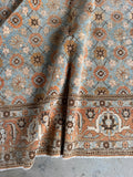 Detailed view of handmade 1920s Persian Tabriz rug with powder blue wool, floral motifs, and fine knotting.