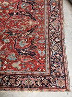9x12 Persian Heriz rug with dragon vines and terracotta red ground

