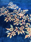 Clean, hefty Art Deco Chinese rug with rich color saturation and floral details.
