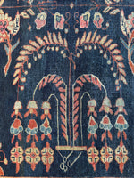 Close view of playful botanical motifs on a 1920s Mahal rug.