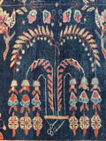 Close view of playful botanical motifs on a 1920s Mahal rug.