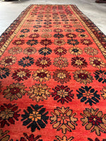 Mid-century Persian runner featuring rows of colorful flowers.
