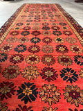 Mid-century Persian runner featuring rows of colorful flowers.