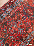 Vegetable-dyed Karaja Persian rug detail focusing on the vibrant tones and authentic old-world wool texture.