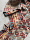 Antique Persian Mahal runner folded showing floppy handle.