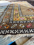 Camel and brown antique runner with geometric medallions and floral detailing.