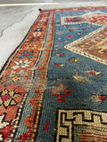 Caucasian rug with cross motifs guarding against the evil eye.