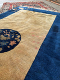 Hand knotted Art Deco rug woven with vegetable dyed wool and open center field design.