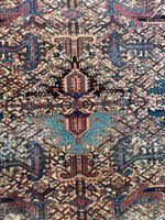 Close-up of central medallion showing intricate color switch with charcoal gray and turquoise blue