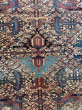 Close-up of central medallion showing intricate color switch with charcoal gray and turquoise blue