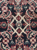 Close-up of wool pile with Herati pattern on charcoal field