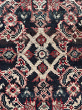 Close-up of wool pile with Herati pattern on charcoal field