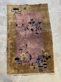 Full view of 1920s Chinese Art Deco rug with minimalist design and floral motifs.