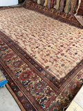 Extra large antique Persian rug showcase with low pile and authentic aged texture.