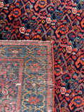 Texture underside view of stout and solid antique Persian rug with rich natural dyes.