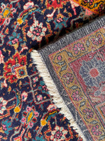 Underside view of collectible vintage Persian scatter rug offering both beauty and comfort.