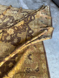 Corner view of vintage Agra rug with floral detailing.