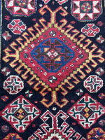Close-up of powerful central diamond medallion with ram’s horn outline.