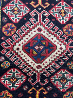 Detailed view of eight-pointed star motifs near medallions.
