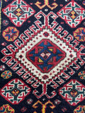 Detailed view of eight-pointed star motifs near medallions.