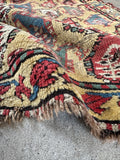 Worn antique Caucasian scatter rug with tribal paisley columns, late 19th century handmade wool accent rug.