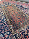 Antique Persian scatter rug with worn farmhouse style, late 19th century hand knotted wool rug.