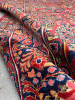 Antique Persian rug with ornate floral motifs 