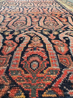 Close-up of paisley motifs with intricate floral designs.
