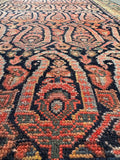 Close-up of paisley motifs with intricate floral designs.