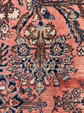 Antique Persian Dargazine Area Rug showcasing soft coral tones, blue floral motifs, and beautiful color variation throughout.