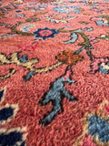 Persian Mahal area rug 9x12 showcasing detailed vine-and-palmette motifs across a warm coral field.