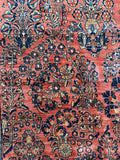 Grand scale Persian Sarouk rug in coral, navy and ivory.