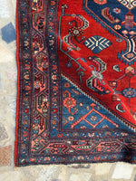 Corner detail of the Malayer rug showing strong pattern contrast.