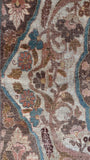 Large vintage Persian rug from the 1920s with finely woven floral details and teal-blue accents.